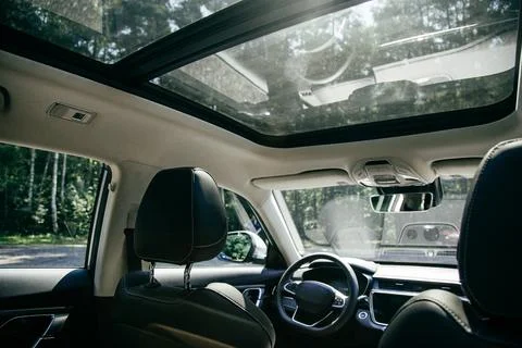 Panoramic roof, dashboard. The view from the empty car Stock Photos