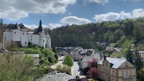 Panoramic, scenic view of Clervaux Castle and Clervaux town houses. Luxembourg Stock Footage 308528927