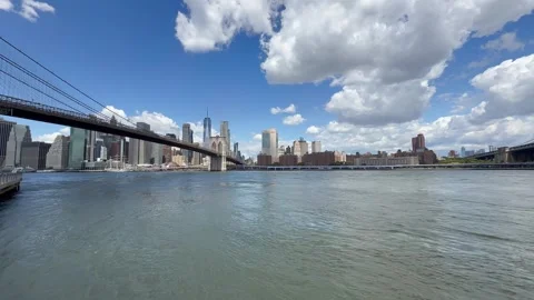 Panoramic, scenic view of Lower Manhattan. East River waves. New York City Stock Footage 337837545