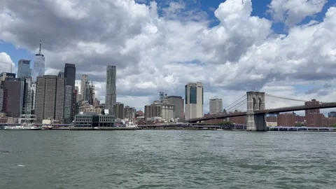 Panoramic, scenic view of Lower Manhattan. East River waves. New York City Stock Footage 337837585