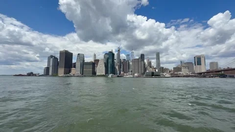 Panoramic, scenic view of Lower Manhattan. East River waves. New York City Stock Footage 337837822