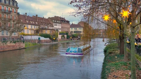 Panoramic ship of Strasbourg at sunset sailing through canal at Christmas Stock Footage 124479913
