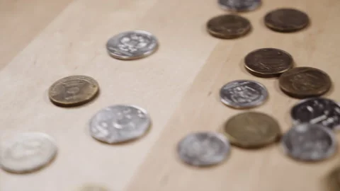 Panoramic shooting of coins lying on the table 스톡 동영상 152415977