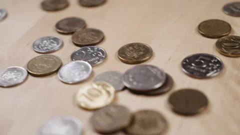 Panoramic shooting of coins lying on the table Stock-Footage 152416095