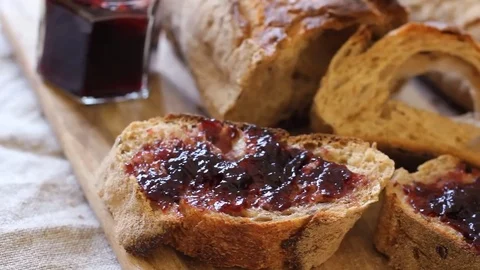 Panoramic shooting macro. delicious fresh baguette bread from rye flour. large Stock Footage 73746633