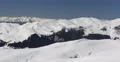 Panoramic Shot Aerial View Pan Left Winter Landscape Snow Covered Cold Mountains 4k or 4k+ Resolution