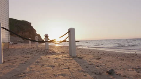 Panoramic shot of beach at sunset with lifeguard house Stock Footage 225531663