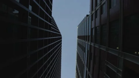 Panoramic shot between two high office buildings. The business district at dawn. Stock Footage 152020970