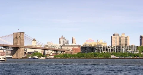 Panoramic shot of Brooklyn skyline and ship docked on Manhattan side Stock Footage 77262605
