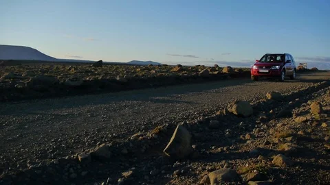 Panoramic shot of a car in a desert at sunset, in central Iceland Video stock 71281850