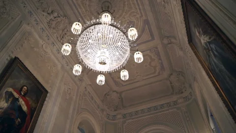 Panoramic shot of the chandeliers inside a classic hall in st. petersburg Stock Footage 195934168