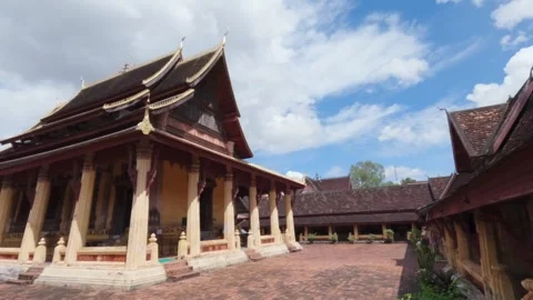 Panoramic shot of courtyard of a Buddhist temple Wat Si Saket on a sunny day Stock Footage 285918571