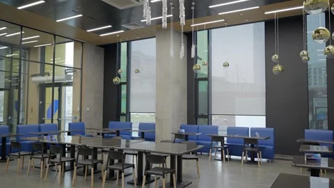 Panoramic shot of empty cafeteria. Large canteen with panoramic windows. Stock Footage 302473556