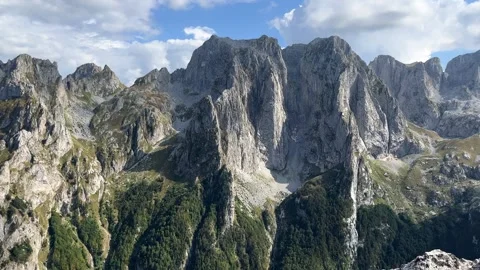 Panoramic shot of epic cliffs in the Dolomites on a sunny summer day Stock Footage 283393633