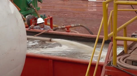 Panoramic Shot of fluids being downloaded to a container Stock Footage 45236558