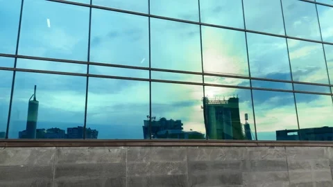 Panoramic shot of the mirror facade of the building Stock Footage 244026733