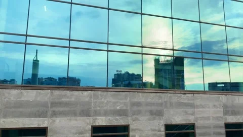 Panoramic shot of the mirror facade of the building Video stock 244026756