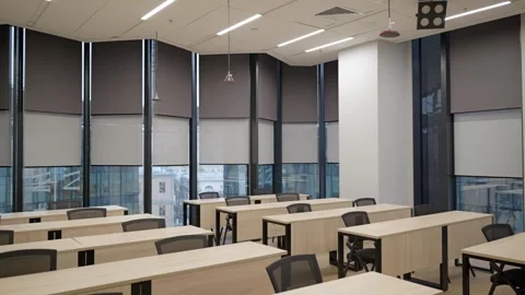 Panoramic shot of modern empty classroom, lecture room, with panoramic windows Stock Footage 302473583