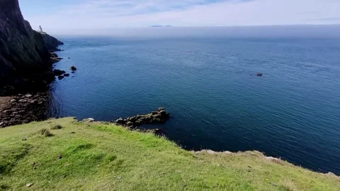Panoramic shot with the Neist Point lighthouse in the distance Stock Footage 293088205
