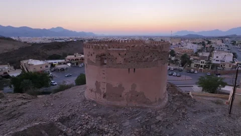 A panoramic shot of one of the old towers in Birkat Al-Mawz Stock Footage 337874248