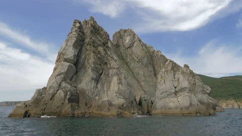 Panoramic shot from the open sea of rocks and cliffs near the coastline. Rocky Stock Footage 221939110
