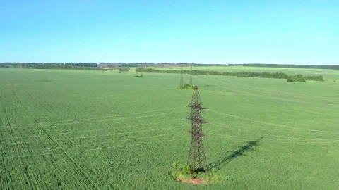 Panoramic shot over the field through which the power line passes. Stock Footage 119072391