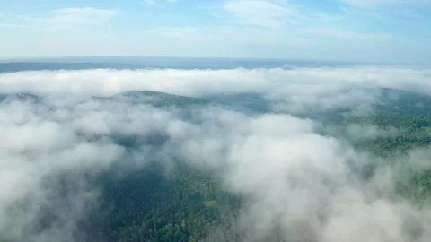 Panoramic shot over a mountain zone in the fog. Stock Footage 114978749