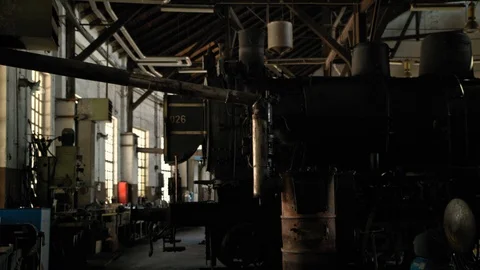 Panoramic shot over an old warehouse with parked steam locomotives Stock Footage 107195713
