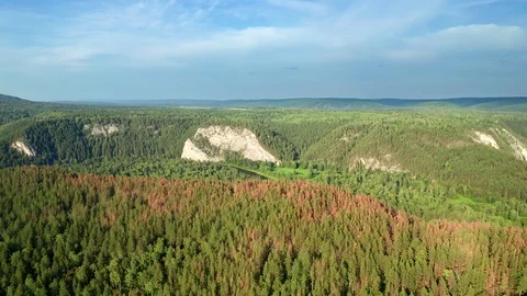 Panoramic shot over a river valley surrounded by mountains. Stock Footage 114976893