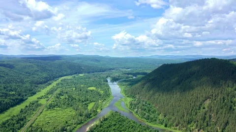 Panoramic shot over a river valley in a mountainous forest zone Stock Footage 116677269