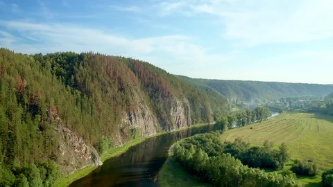 Panoramic shot over the river with a view of the mountain range Stock Footage 114976758