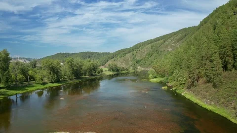 Panoramic shot over the shallow part of the river. 스톡 동영상 114878558