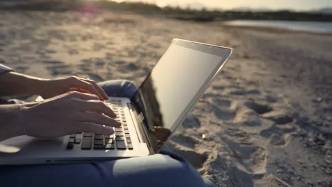 Panoramic shot right to left from sea ocean to close up of woman hands working a Stock Footage 151250733