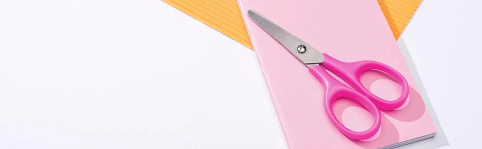 Panoramic shot scissors notebook paper Stock Photos