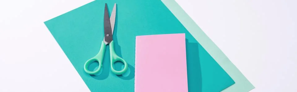 Panoramic shot scissors notebook paper Stock Photos