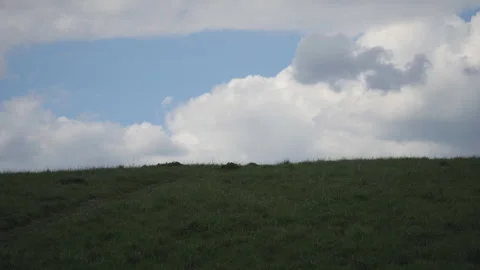 A panoramic shot of the sky above a dark green field. Stock Footage 269703534