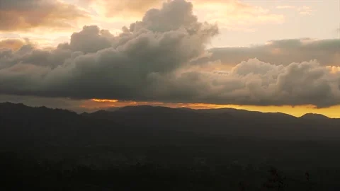 Panoramic shot of a sunset sky over the mountains with misty forest. Beautiful Stock Footage 208817828