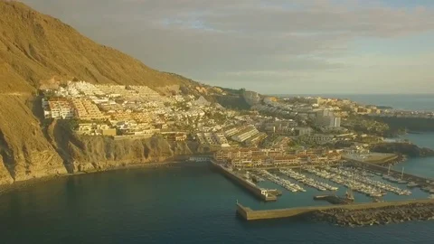 Panoramic shot at sunset view of the port of Los Gigantes Tenerife Видео 74656866
