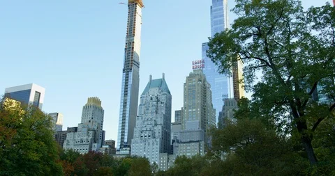 Panoramic Shot Of Trees Surrounding Impressive New York Skyline  Stock Footage 112587222