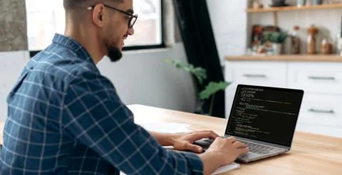 Panoramic side view photo of a programmer with laptop. Clever successful guy, an 스톡 사진