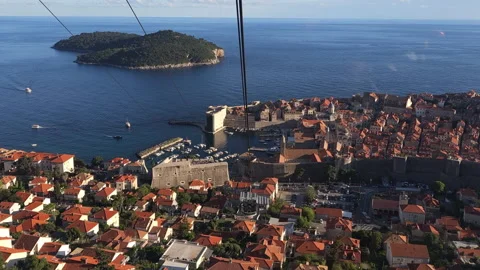 Panoramic slow motion ascending cable car view of Dubrovnik town, Croatia, 4k Video stock 276364998