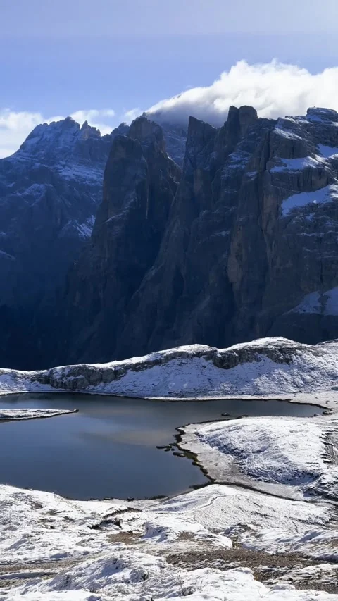 Panoramic snowy alpine valley with mountain lakes in Dolomites landscape. Stock Footage 330437438