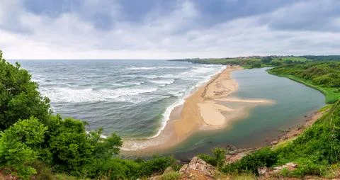 Panoramic spring view with beautiful wild beach Stock Photos