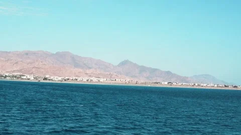 A panoramic summer landscape captures a vast blue sky over the open ocean Stock Footage 329236691