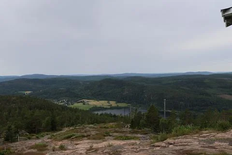 Panoramic summer view of forest and rugged coastline from the summit of Skule Stock Photos