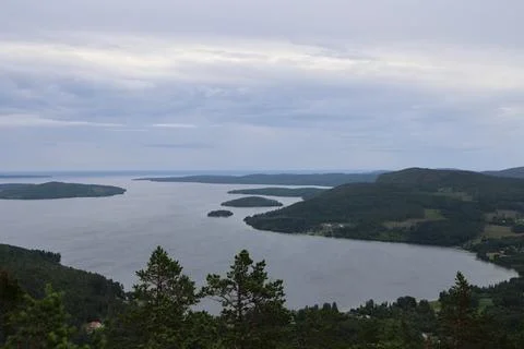 Panoramic summer view of forest and rugged coastline from the summit of Skule Stock Photos