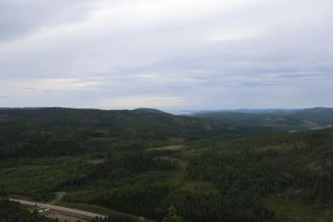 Panoramic summer view of forest and rugged coastline from the summit of Skule Stock Photos