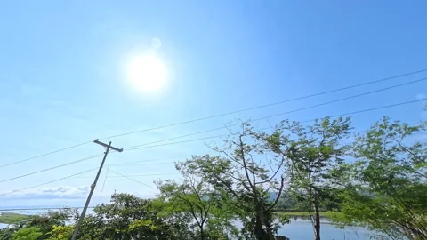 Panoramic sunrise view over a river, ocean, and distant bridge Stock Footage 339263917
