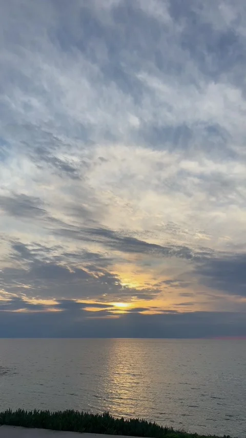 Panoramic sunset over the calm Mediterranean Sea, with a golden sky and soothing Stock Footage 308917896