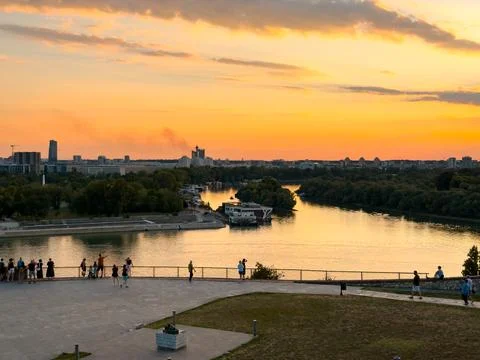 Panoramic sunset over Sava River with visitors at Kalemegdan viewpoint Stock Photos
